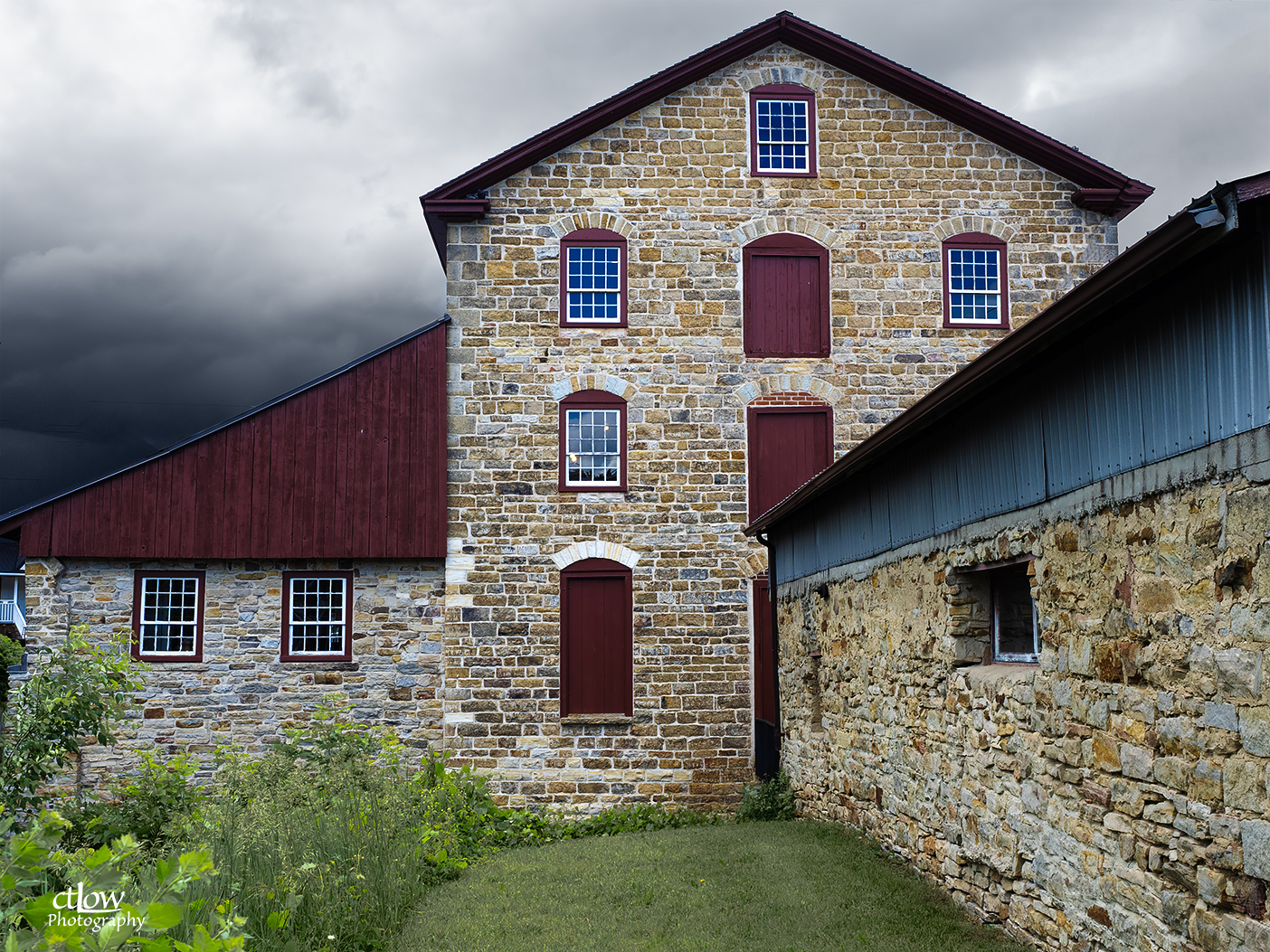 The Old Stone Mill emerging from morning mist, stone walls and soft autumn light