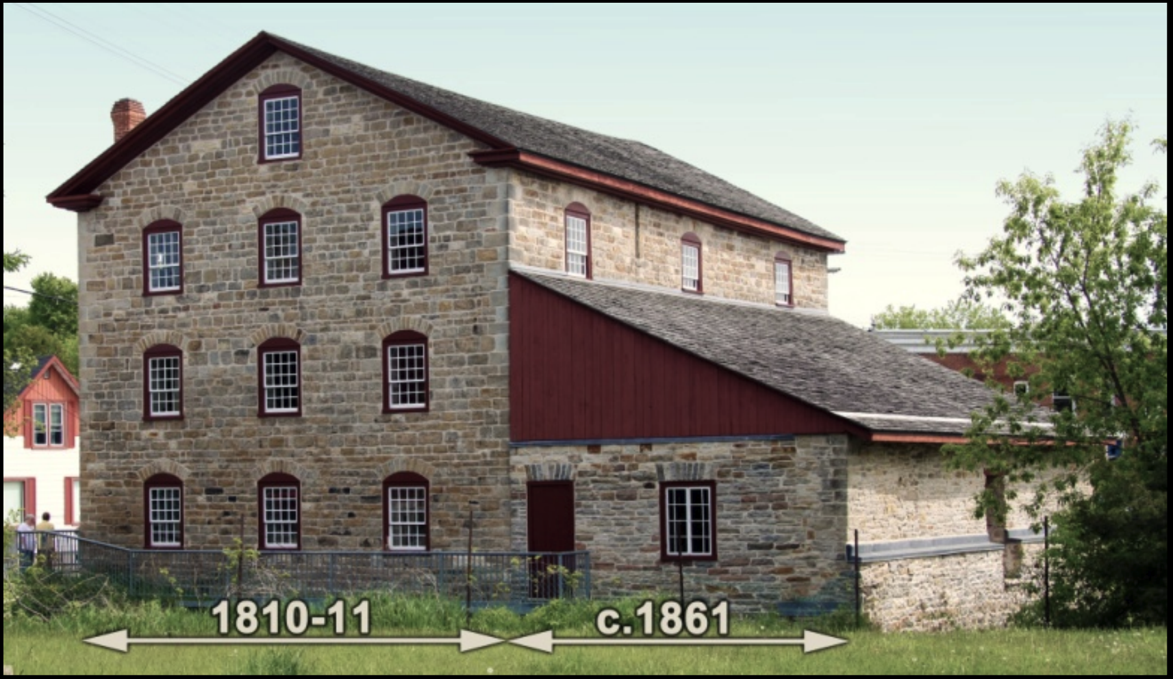 Annotated photograph of the Old Stone Mill identifying the original 1810–11 section and the c.1861 turbine hall addition