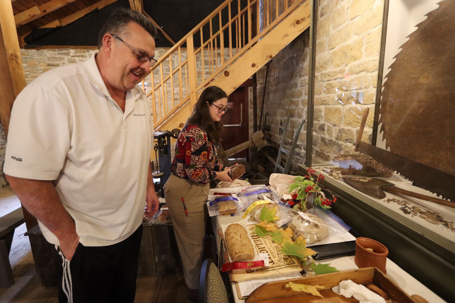 The mill interpreters at the doorway — a moment of warmth and shared welcome