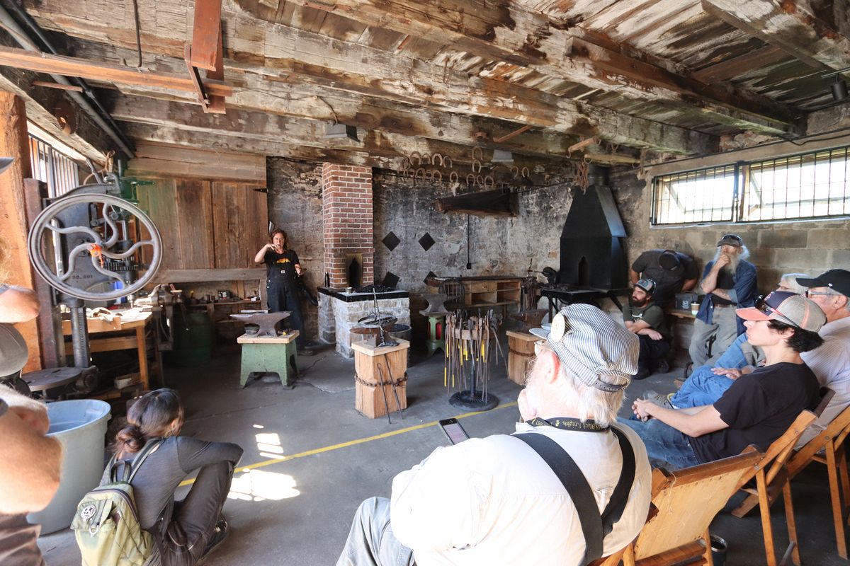 Blacksmith Megan Carter working at the forge on a September morning