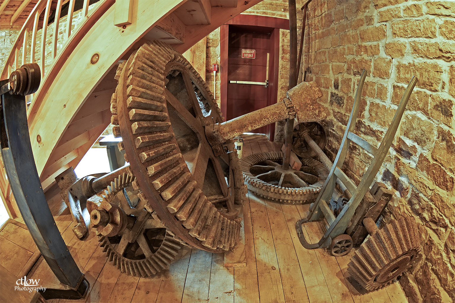 Cast-iron gearing inside the Old Stone Mill — the great wheel and pinion of the milling machinery